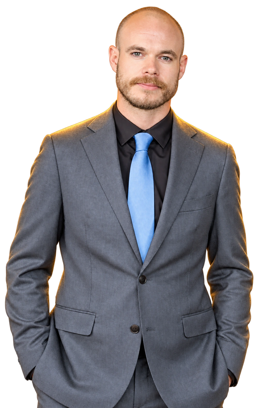 Tristan Alexander in a grey suit and blue tie